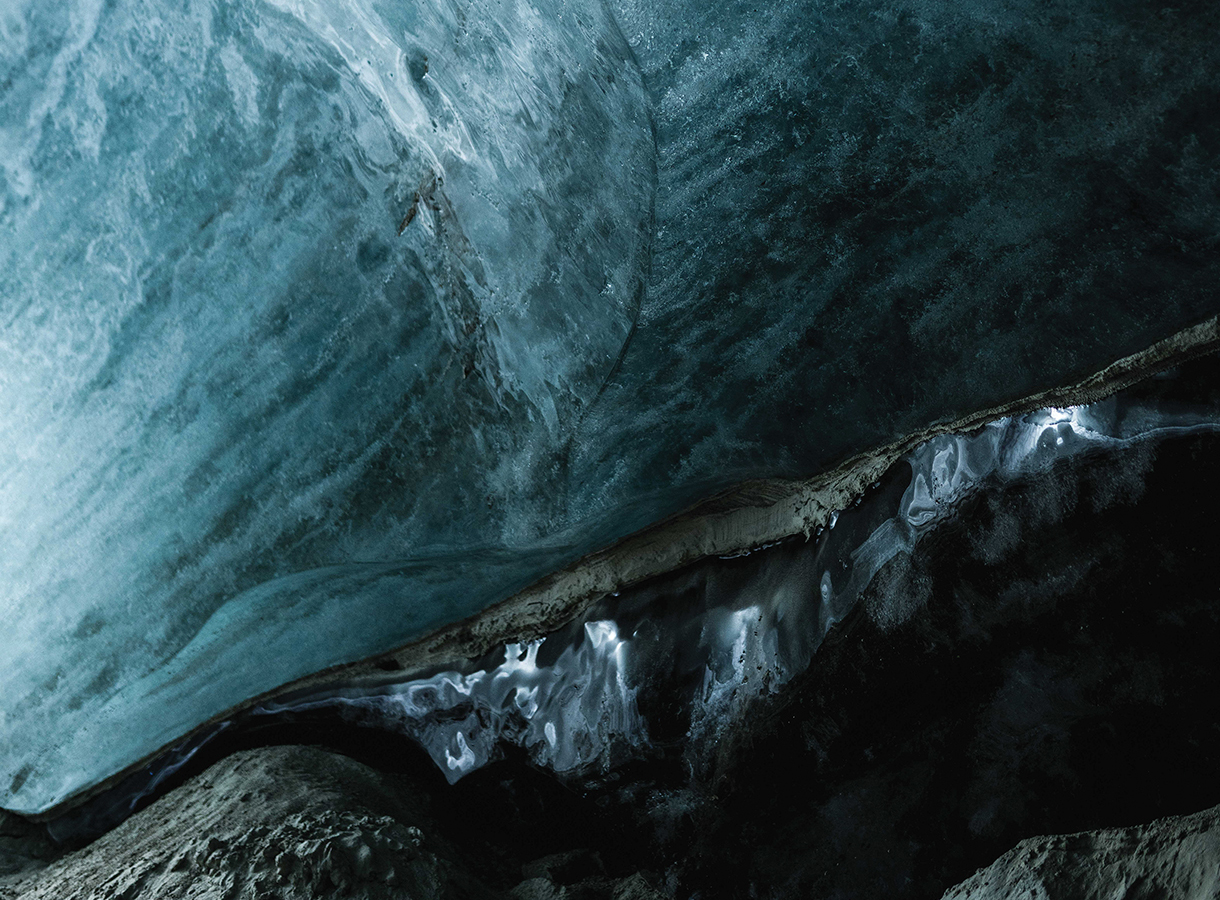 Inside dark blue ice cave  